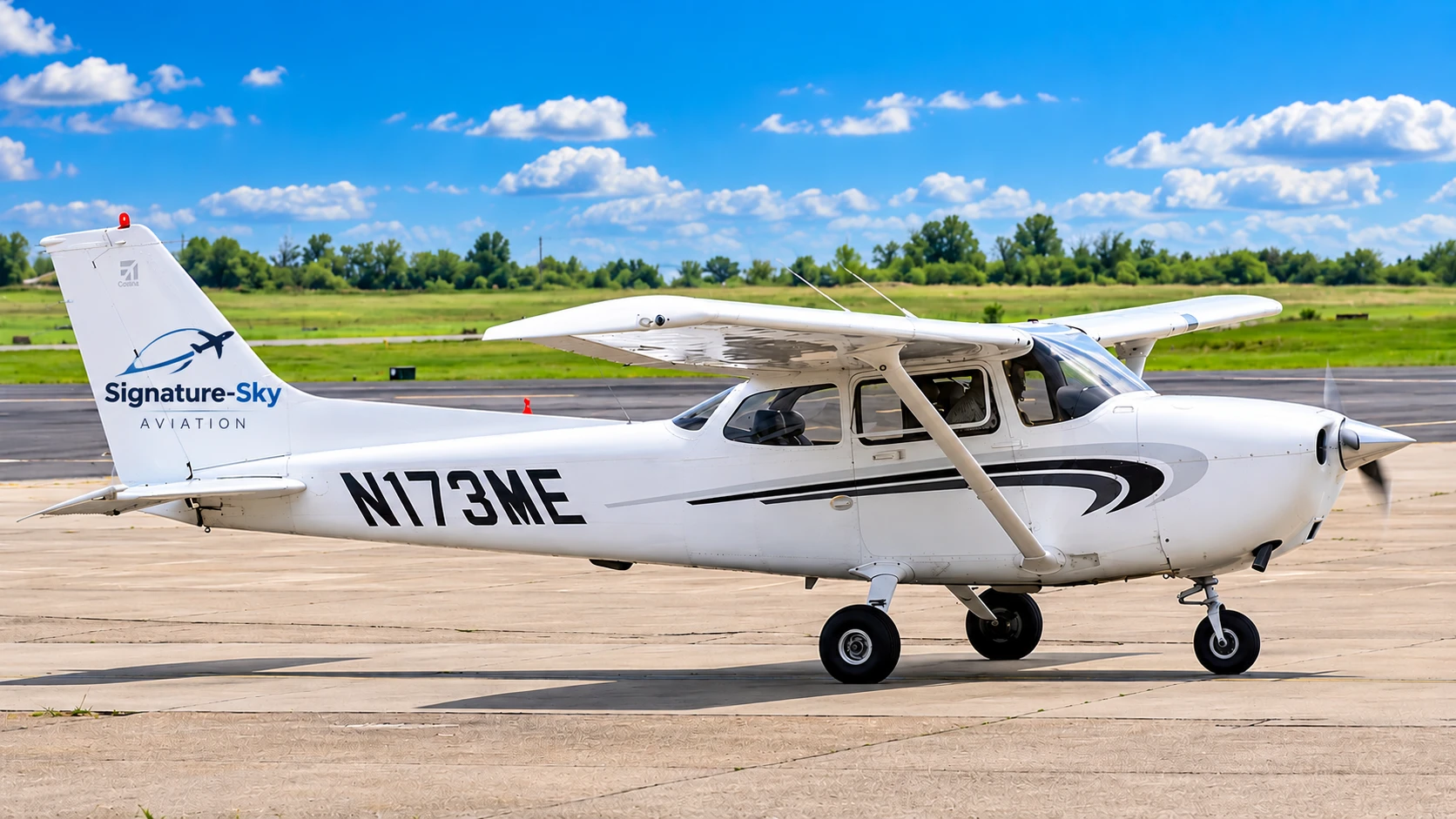 A Signature-Sky branded training aircraft parked on the tarmac