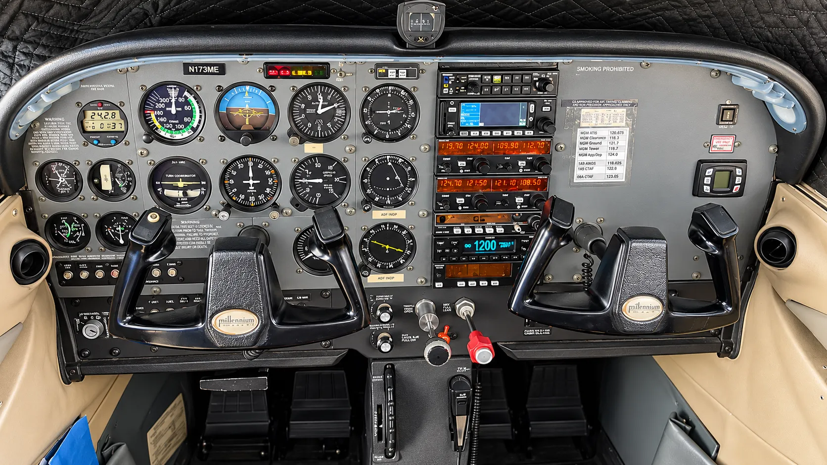 Analog general aviation cockpit instruments viewed from the pilot seat